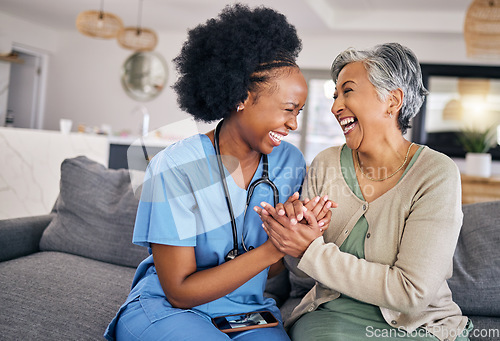 Image of Smile, funny and assisted living caregiver with an old woman in her home during retirement together. Healthcare, support and a happy nurse or volunteer laughing with a senior patient on the sofa