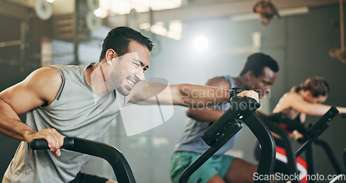 Image of People, diversity and cycling at gym in fitness, workout or intense cardio exercise together and motivation. Diverse group burning sweat on bicycle machine for healthy body, wellness or lose weight