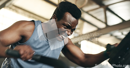 Image of Black man, fitness and cycling at gym in cardio workout, exercise or intense training on machine. African male person on bicycle equipment in sweat or running for muscle, endurance or stamina at club