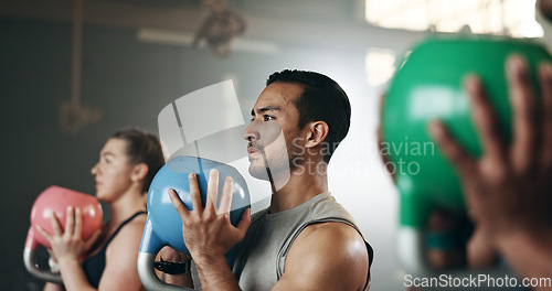 Image of Gym, group fitness and kettlebell squat exercise for power, sports challenge and muscle. Serious asian man, bodybuilder and heavy weights for training in health club, workout class and strong friends