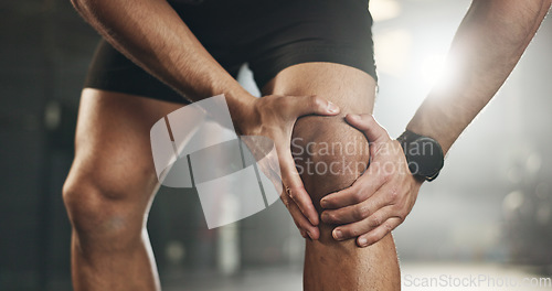 Image of Fitness, knee pain and hands of man at gym for training with muscle, problem or arthritis. Sports, injury and leg of male athlete with joint massage for fibromyalgia, osteoporosis or bone accident