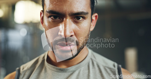 Image of Man, sweating face and breathing in gym for fitness challenge, exercise endurance or break. Serious portrait, strong asian bodybuilder and tired for training, workout fatigue and breathe for recovery