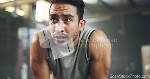 Image of Sweat, fitness and man tired from gym, workout or rest in training in cardio, sports and body builder breathing with fatigue. Exhausted, break and athlete with commitment for health challenge