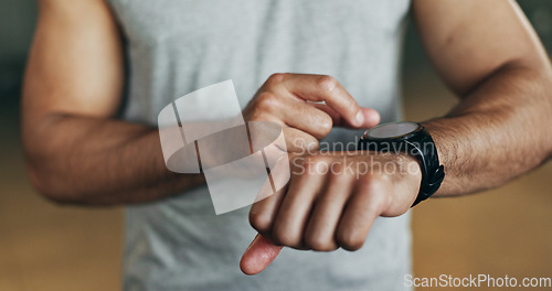 Image of Smart watch, hands and man in gym for fitness, exercise results and workout performance. Stopwatch, closeup and check information, timer and tracking healthy training progress, clock and sports gear