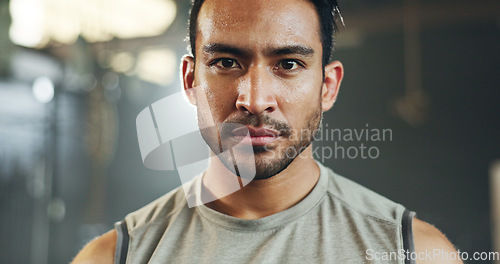 Image of Man, sweating face and breathing in gym for fitness challenge, exercise endurance or break. Serious portrait, strong asian bodybuilder and tired for training, workout fatigue and breathe for recovery