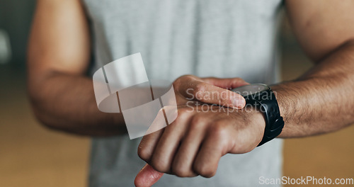 Image of Smart watch, hands and man in gym for fitness, exercise results and workout performance. Stopwatch, closeup and check information, timer and tracking healthy training progress, clock and sports gear