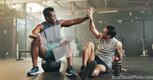 Image of Happy man, high five and fitness in sports motivation, teamwork or partnership at the gym. People touching hands in workout, exercise or training together for physical health or wellness at gymnasium