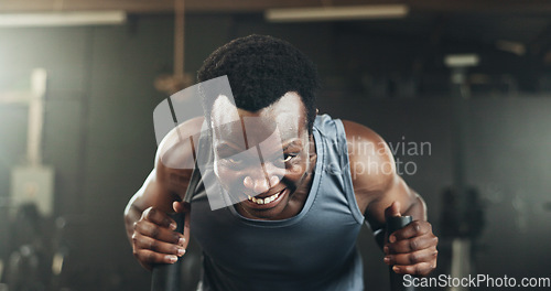 Image of Black man at gym, weight sled and muscle endurance, strong body and core balance power in fitness. Commitment, motivation and bodybuilder in workout challenge for health and wellness on push machine.