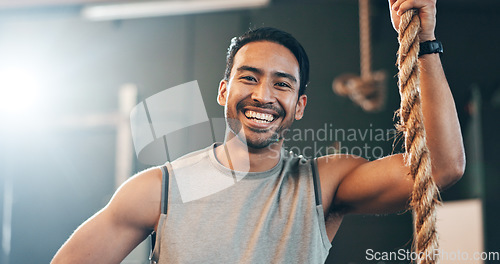 Image of Fitness, gym and face of man with rope for training, bodybuilder exercise and intense workout. Sport, personal trainer and portrait of happy person with equipment for wellness, performance and muscle
