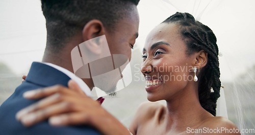 Image of Outdoor, kiss and black couple with marriage, wedding and hug with happiness, romance and celebration. African man, happy woman and embrace outside, love and bride with groom, romantic and commitment