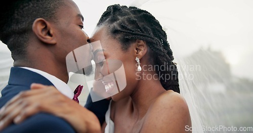 Image of Outdoor, kiss and black couple with love, wedding and hug with marriage, happiness and celebration. African man, happy woman and embrace outside, event and bride with groom, romance and countryside