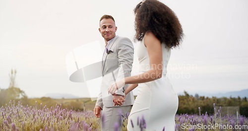 Image of Wedding, holding hands and happy couple walking garden with love, celebration and excited future together. Field, man and woman at boho marriage reception with flowers, smile and commitment in nature