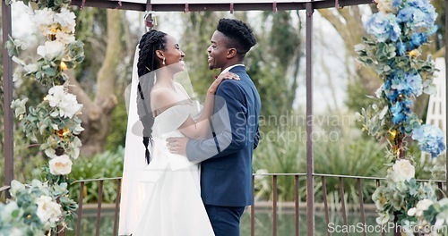 Image of Wedding, dance and black couple in garden with love, celebration and excited future together. Gazebo, man and woman at luxury marriage reception with flowers, music and happiness at party in nature.