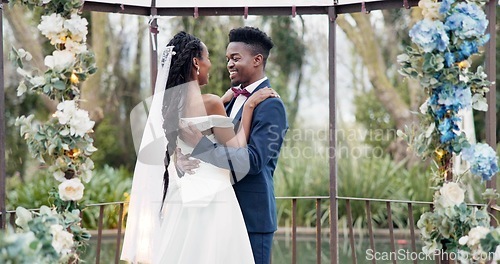 Image of Wedding, first dance and black couple in garden with love, celebration and excited for future together. Gazebo, man and woman at marriage reception with flowers, music and happiness at outdoor party.