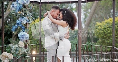 Image of Wedding, bride and groom dancing with hug and happiness at ceremony with life partner and commitment. Marriage, trust and people in interracial relationship, event decor and nature, love and care