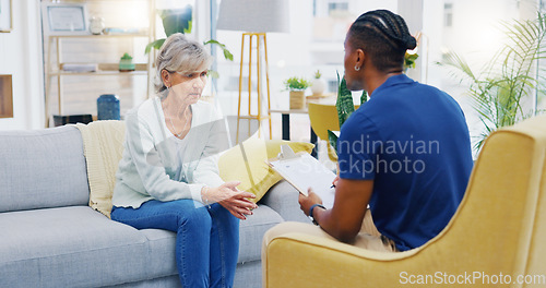 Image of Retirement, clipboard and a nurse talking to an old woman patient about healthcare in an assisted living facility. Medical, planning and communication with a black man consulting a senior in her home