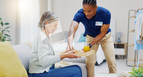 Image of Breakfast, assisted living and retirement with a old woman on a sofa in the living room of her home. Morning, food and a nurse black man serving a meal to an elderly patient in a care facility
