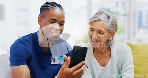 Image of Phone, medical and a nurse talking to a patient in an assisted living facility for senior people. Healthcare, mobile and contact with a black man medicine professional chatting to a mature woman