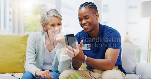 Image of Phone, medical and a nurse talking to a patient in an assisted living facility for senior people. Healthcare, mobile and contact with a black man medicine professional chatting to a mature woman