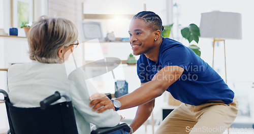 Image of Black man, caregiver speaking or old woman in wheelchair talking or supporting in homecare rehabilitation. Medical healthcare or happy male nurse nursing or helping elderly patient with disability