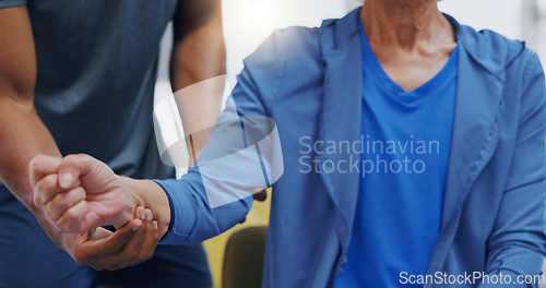 Image of Hands, physiotherapy and recovery with a patient training while listening to her therapist for rehabilitation. Healthcare, fitness or exercise with a person and physiotherapist during a workout