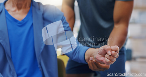 Image of Hands, physiotherapy and recovery with a patient training while listening to her therapist for rehabilitation. Healthcare, fitness or exercise with a person and physiotherapist during a workout