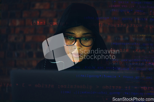 Image of Hacker, woman in basement and laptop, coding and IT with code overlay, database with phishing and cyber crime. Cybersecurity, programming or hacking, criminal with pc for ransomware and firewall