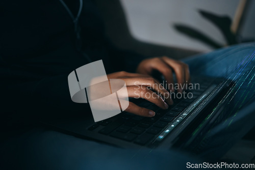 Image of Hacker, hands typing on laptop and information technology for coding and database with phishing and cyber crime. Cybersecurity, person programming or hacking, criminal with ransomware and firewall