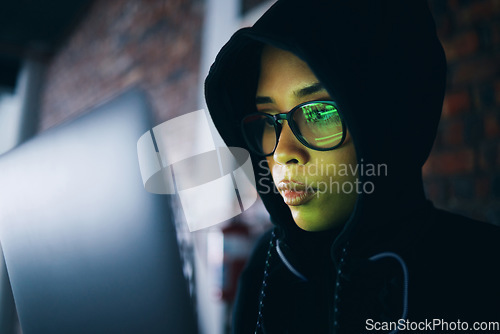 Image of Hacker, woman in dark room with laptop and coding, phishing and cyber crime with IT database or server. Cybersecurity, programming and criminal with pc in basement, ransomware and hacking firewall