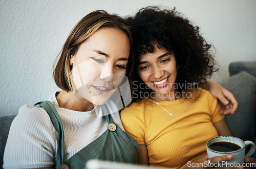 Image of Couple sofa and women relax with coffee and technology for social media, internet and watching video. Love, lgbtq and happy people in living room for bonding, relationship and streaming movies