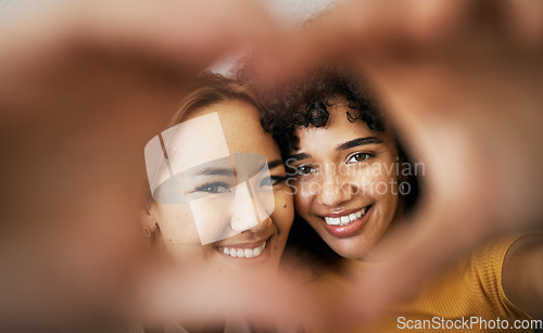 Image of Lesbian couple, smile and heart with hands, portrait and closeup for romance, bonding and love and support for relationship. Happy people, together and solidarity for pride, lgbtq and hope for peace