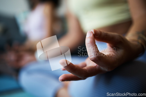 Image of Woman, hands and zen for yoga, sitting and mediation for spiritual wellness, exercise and fitness. Positive energy, chakra and health in sportswear, relax and balance in lotus pose, peace and healing