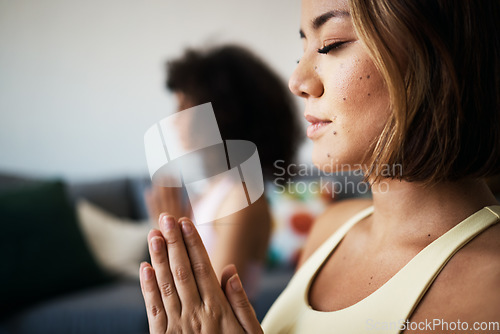 Image of Women, fitness friends and meditation with prayer for mindfulness, wellness and peace of mind at home. Yoga, spiritual and calm in lounge with healing and zen, namaste with exercise and self care