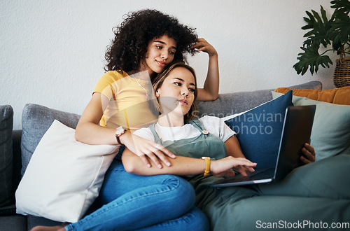 Image of Lgbtq, laptop and women relax on sofa for watching movies, streaming series and online videos. Dating, lesbian and happy couple on computer for internet, bonding and relationship in living room