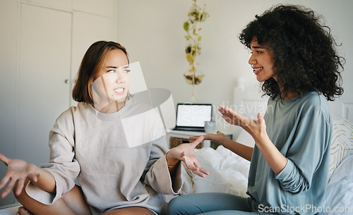 Image of Lgbtq, women and couple argue in bedroom of home with conflict, crisis or problem in relationship. Lesbian, partner and girl on bed with stress, anxiety and depressed for argument, divorce or fear