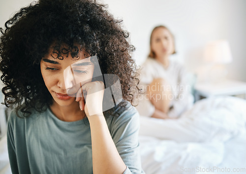 Image of Lgbtq, woman and sad for couple fight in bedroom of home with conflict, crisis or problem in relationship. Lesbian, partner and girl on bed with stress, anxiety and depressed for argument and divorce
