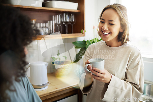 Image of Coffee, smile and lesbian couple talking in home, bonding or communication. Drink tea, gay women and happy girls in the morning at breakfast together in healthy LGBT relationship, funny and excited