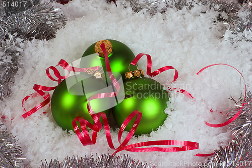 Image of Green Xmas Ornaments with snow and garland