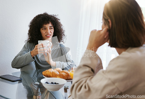 Image of Coffee, breakfast and lesbian couple at table in home, bonding and communication. Drink tea, gay women and girls talking in the morning, eating food and relax together in healthy LGBT relationship