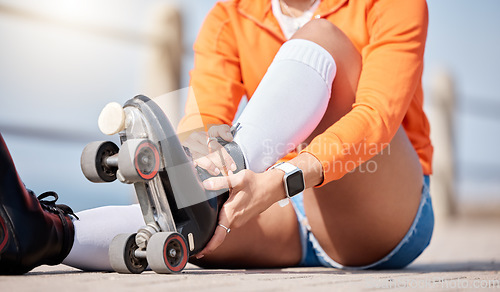 Image of Woman, hands and shoes to roller skate outdoor for exercise, workout or training with wheels on sidewalk or ground. Start, sport and person with cardio, fitness or rollerskating gear in summer