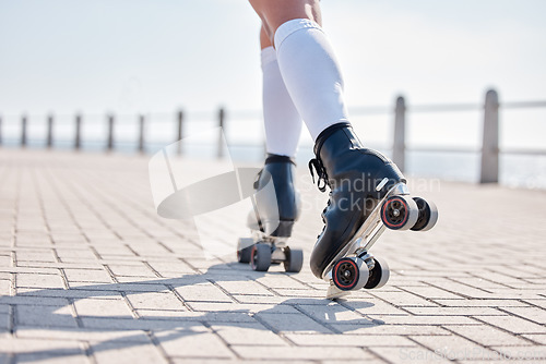 Image of Person, roller skate and exercise in closeup for summer, alone or back view with skill, balance and sport. Model, caucasian and boardwalk for fitness, activity or wellness in race, cardio or health