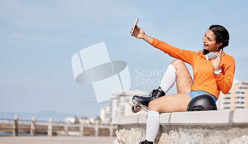Image of Roller skating, woman and selfie with smile for profile picture, internet post and social media outdoor in nature. Sport, person and headphones by ocean or sea for relax, freedom and happiness online