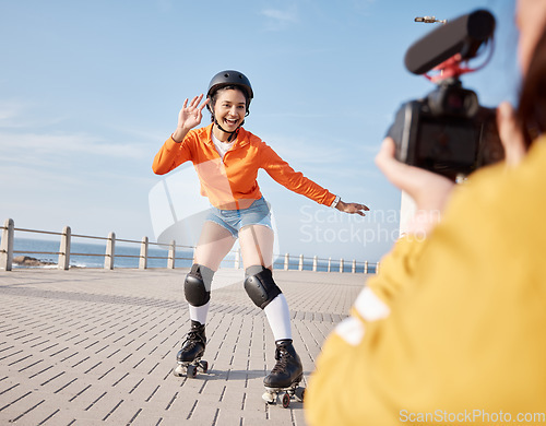 Image of Girl, rollerskates and smile for camera, boardwalk and fun by ocean, sea and outdoors for hobby. Active person, skating and sport in summer, protection and gear for safety, energy and happy in summer