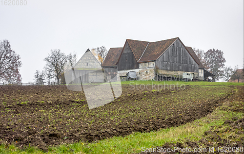 Image of old farmhouse at autumn time