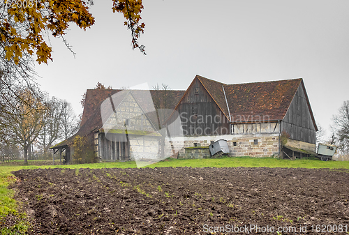 Image of old farmhouse at autumn time