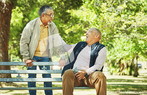 Image of Elderly friends, laughing and relax at park bench, talking and bonding outdoor in retirement. Funny, smile and senior men sitting together in garden, communication and support to comfort in nature