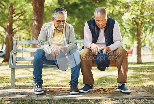 Image of Elderly men, park and praying with faith, nature and communication to god for spiritual insight. Diversity, closeup and senior person with religion with hats down, respect and gratitude in retirement