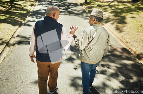 Image of Senior, friends walking and talking in park, nature and outdoor in retirement with support and communication. Elderly, men and above people on sidewalk in Chicago with conversation and community