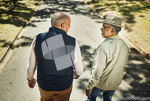 Image of Senior, friends talking and walking in park, nature and outdoor in retirement with support and communication. Elderly, men and above people on sidewalk in New York with conversation and community