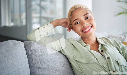 Image of Happy, woman and portrait at home of freelancer relax with a smile on a living room couch. Female person, calm and thinking in a house with remote work break and rest on a lounge sofa with peace